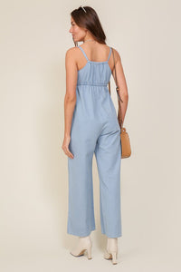 Lumiere DENIM BLUE SLEEVELESS JUMPSUIT WITH SELF FRONT TIE