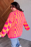 Davi & Dani Noticed in Neon Checkered Cardigan in Pink and Orange